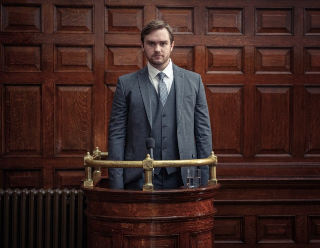 Tom King looks determined, wearing a grey suit, as he takes to the stand at his trial in Emmerdale