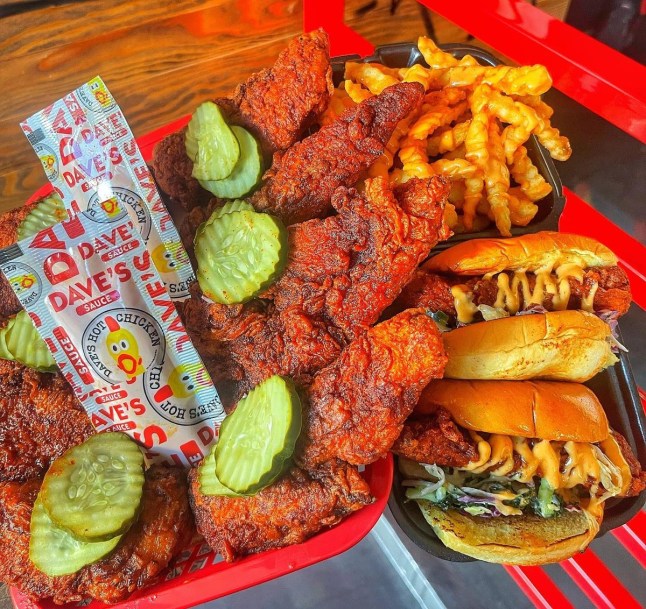 Food from Dave's Hot Chicken on a tray, with chicken sliders and chicken tenders