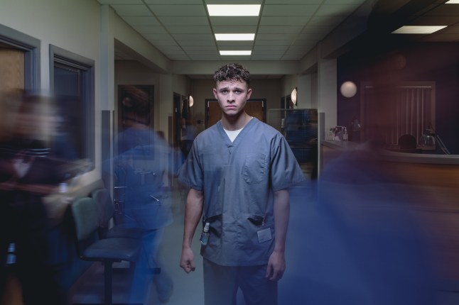 Emmerdale's Jacob Gallagher stands in A&E in a promotional photo