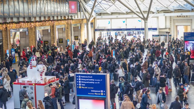 Christmas train passengers gathered at London King's Cross station concourse.