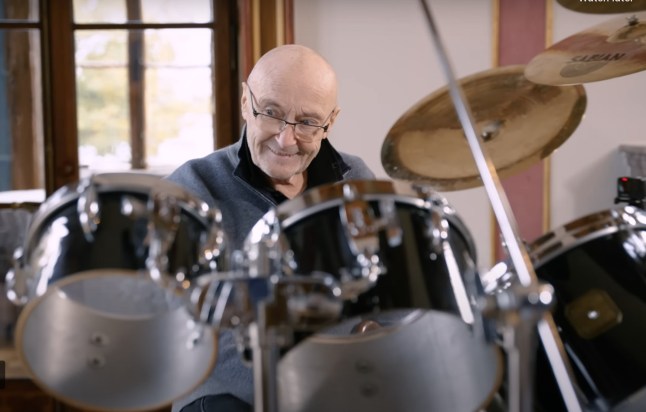 Drummer Phil Collins, 73, has picked up a pair of drumsticks for the first time in years ? after fearing he?d never sit behind a kit again. An emotional Collins, looking frail, appeared overwhelmed by returning to his instrument after having to quit due to neck and back issues. New pics show the former Genesis star at home making the brave step under the watchful eyes of son Nick - who had drummed for him during his farewell tour. In a new documentary about his career, he says: ?If I wake up one day and I can hold a pair of drumsticks then I will have a crack at it. I just feel like I've used up my air miles. It just feels so strange to hold a pair.?(with new pics) Provided by Molly Clayton