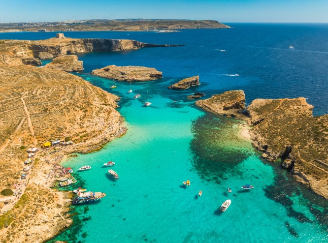 Drone view of boats on the sea, Comino island, Blue lagoon and Crystal lagoon. Malta; Shutterstock ID 2460043767; purchase_order: -; job: -; client: -; other: -