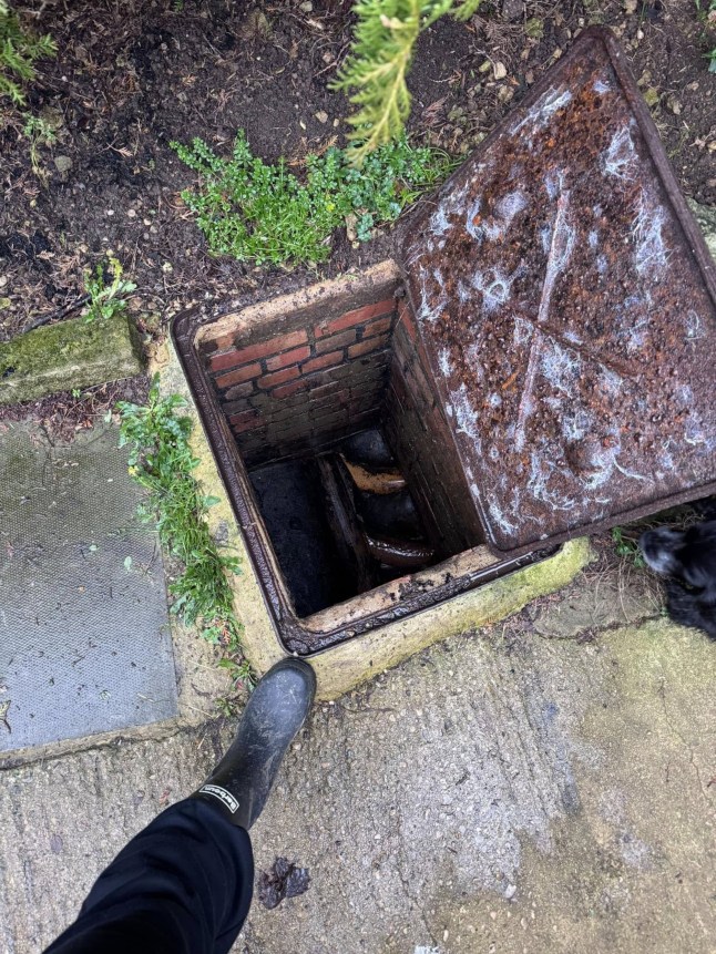 PIC FROM KENNEDY NEWS AND MEDIA (PICTURED: THE MANHOLE ON BETHAN WALKER'S DRIVEWAY) This is the moment a schoolboy plummets down an open manhole on his own driveway - that is 'fuming' mum claims Thames Water workers left open. Footage shows 12-year-old Corey Walker walking to get into his car before he screams and falls down an exposed manhole in his driveway, suddenly disappearing from view. His mum Bethan Walker says she is 'absolutely fuming' as she claims Thames Water workers left the drain uncovered. DISCLAIMER: While Kennedy News and Media uses its best endeavours to establish the copyright and authenticity of all pictures supplied, it accepts no liability for any damage, loss or legal action caused by the use of images supplied and the publication of images is solely at your discretion. SEE KENNEDY NEWS COPY - 0161 697 4266